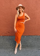 Load image into Gallery viewer, Sustainable bamboo clothing made in Vancouver BC. Eco friendly fabrics. Eco conscious fashion collection made in Vancouver BC. Most popular for fit and quality bamboo clothing made locally in Vancouver BC. Bamboo pencil skirt with side slits in rust colour.