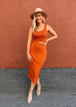 Load image into Gallery viewer, Sustainable bamboo clothing made in Vancouver BC. Eco friendly fabrics. Eco conscious fashion collection made in Vancouver BC. Most popular for fit and quality bamboo clothing made locally in Vancouver BC. Bamboo pencil skirt with side slits in rust colour.
