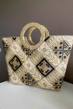 Load image into Gallery viewer, Tan Grass Reed Handbag with White and Black Designs.

