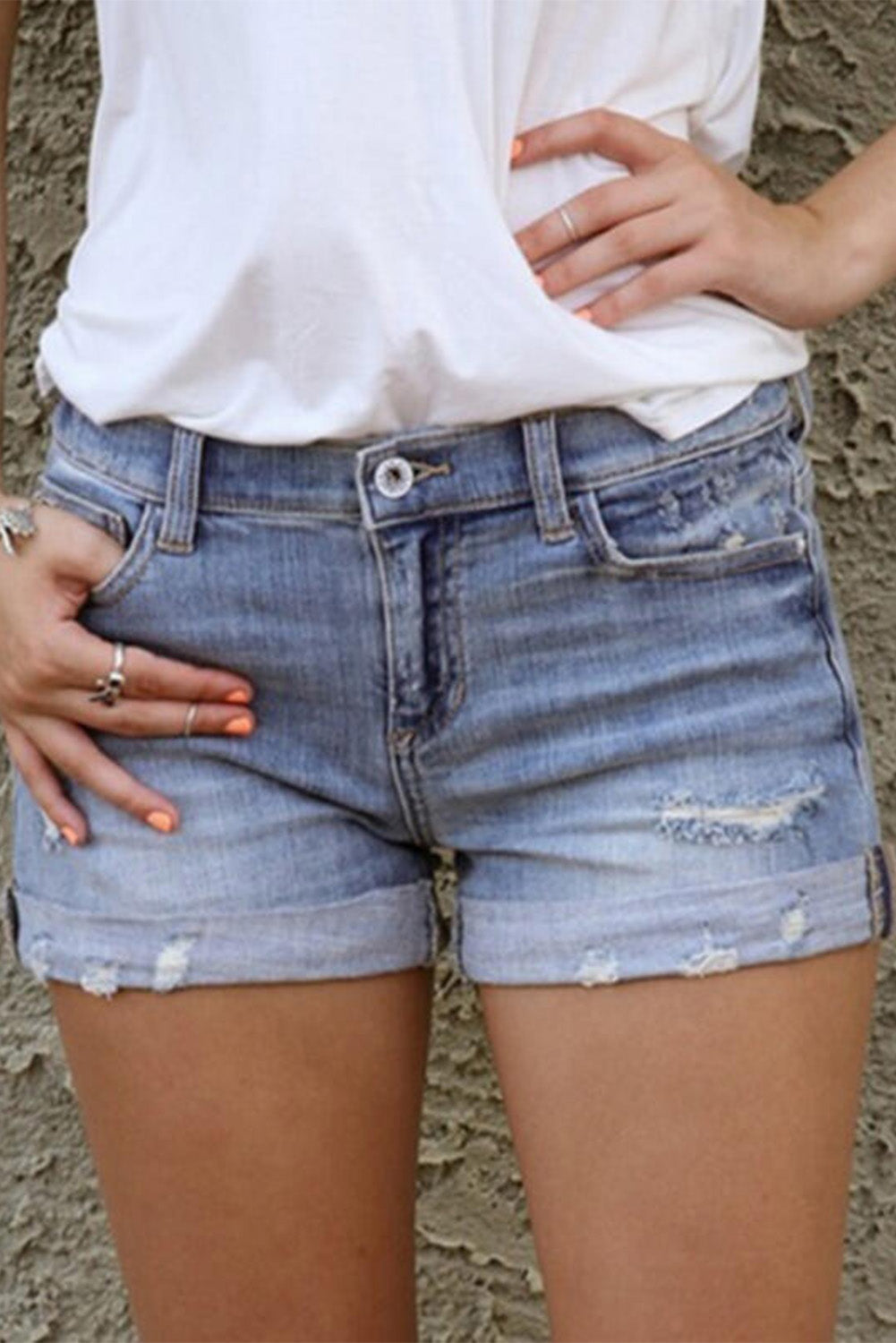 mid rise distressed denim blue jean shorts with pockets. Summer vibe short shorts