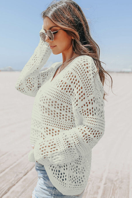 White long sleeved crochet pullover sweater. Good for a cover up in summer or layer in the winter.