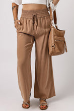 Load image into Gallery viewer, Taupe coloured wide leg beach wear pants. High waisted with drawstring and pockets. Support Abbotsford businesses.
