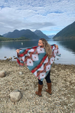 Load image into Gallery viewer, Aztec Print blanket scarves made locally in BC by First Nations artist. Native blankets are perfect for wearing as a cape or shawl but also as a blanket. 60X60 blanket is best for wearing and 80X60 blanket is best for a couch or bed blanket. Wool blend blankets are soft to the touch and very durable. Machine wash in cool water and hang to dry or tumble dry on low. Retains color and softness and will last you for years to come. Aztec and Navajo style blankets from Sunlaced Apparel for sustainable fashion. 
